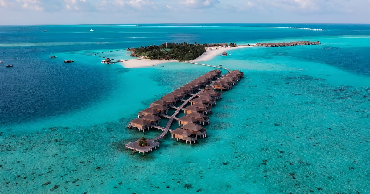 Aerial view of overwater villas on a turquoise lagoon, the Maldives