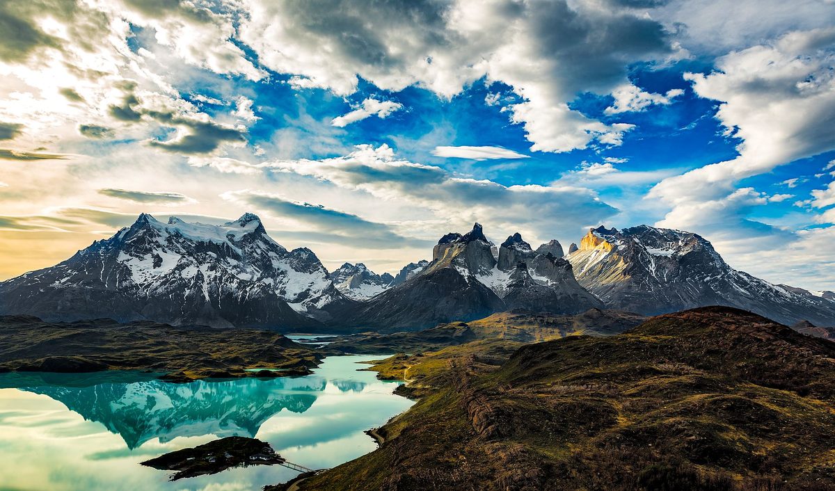 Torres del Paine peaks reflected in a turquoise lake, Patagonia